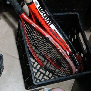 Four different brand/size tennis racquets